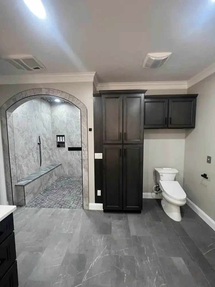Another view: Arched curbless shower with LED rain head, body jets, bench and hex mosaic floor, Avon Lake, Ohio