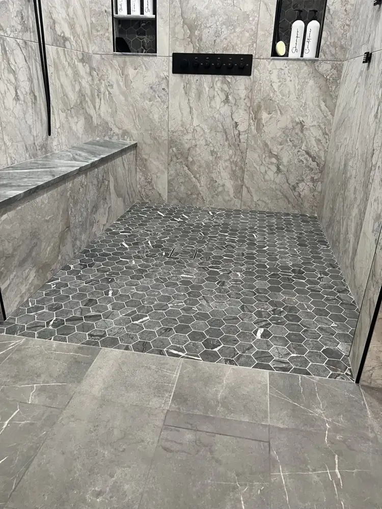 Another view: Arched curbless shower with LED rain head, body jets, bench and hex mosaic floor, Avon Lake, Ohio