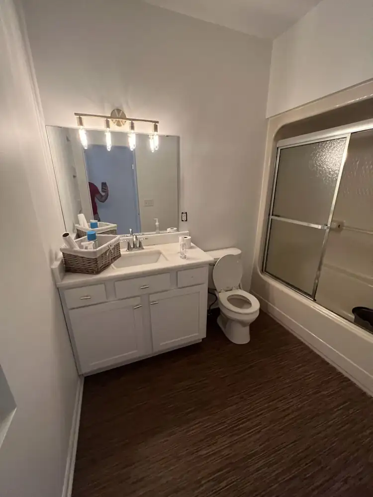 Bathroom before remodel with tub and sliding doors, Amherst, Ohio