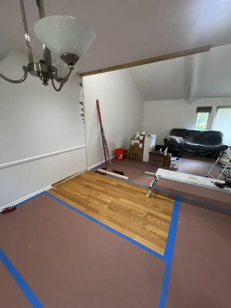 Room corner taped out and floors protected where a new bathroom was built, Aurora, Ohio