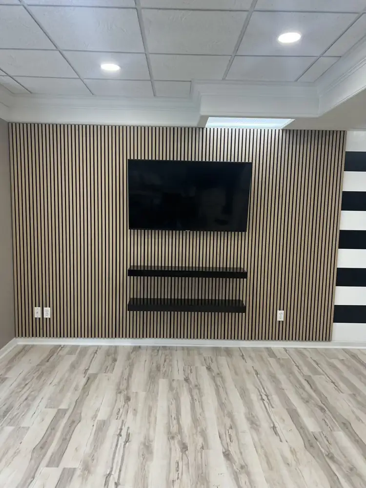 Another view: Custom media wall with built-in linear electric fireplace, wall-mounted TV and six lit display niches, Bedford, Ohio