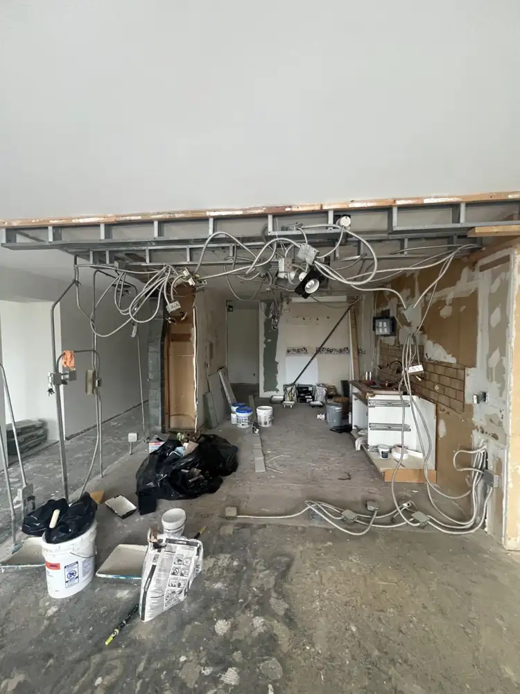 Kitchen gutted to the framing with exposed wiring during remodel, Bratenahl, Ohio