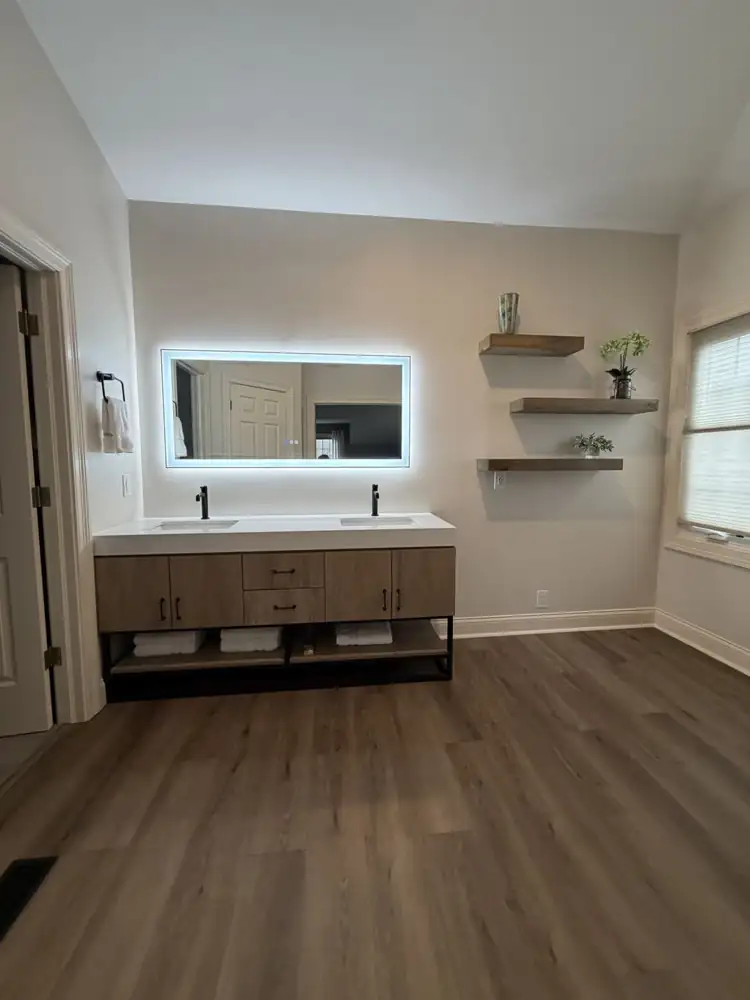 Floating wood double vanity with quartz top, lighted mirror, floating shelves and wood-look plank floor, Brecksville, Ohio