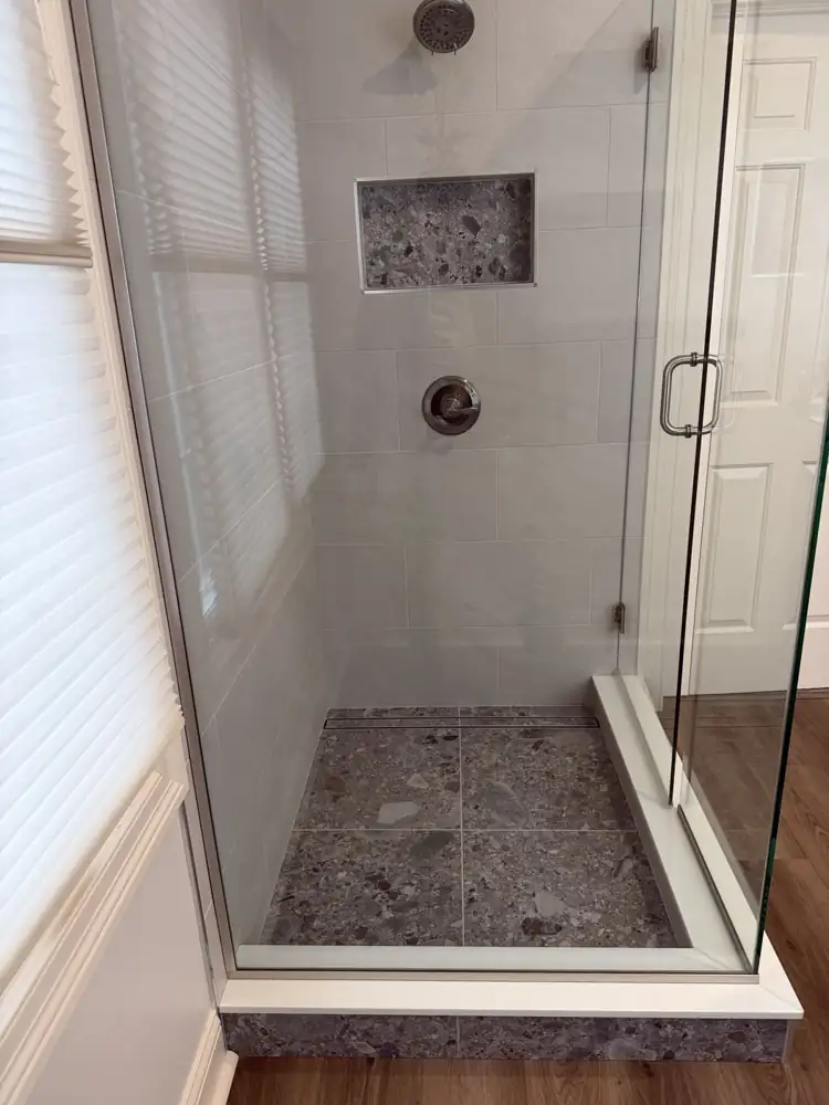 Another view: Floating wood double vanity with quartz top, lighted mirror, floating shelves and wood-look plank floor, Brecksville, Ohio