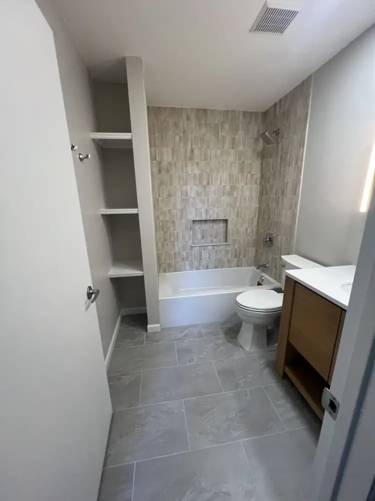 Bathroom with handmade-look vertical tile and tub, Cleveland
