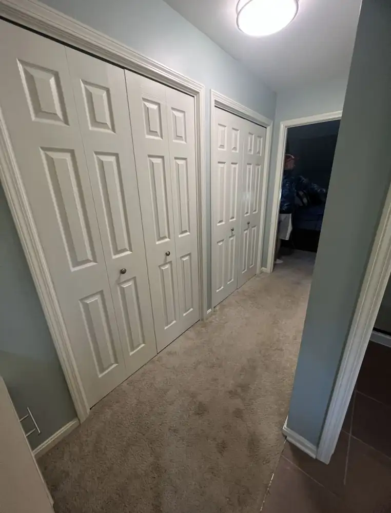 Upstairs hallway with closets before remodel, Hudson, Ohio