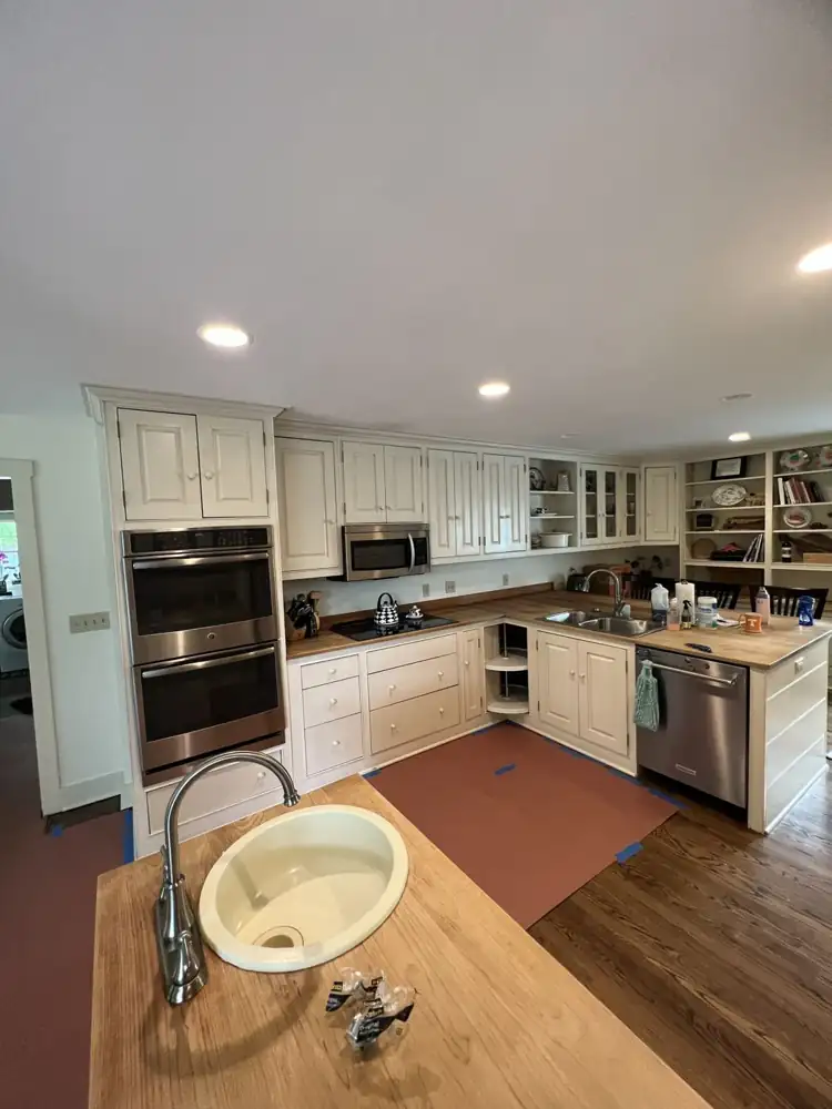 Kitchen with cream cabinets and butcher block counters before remodel, Hudson, Ohio
