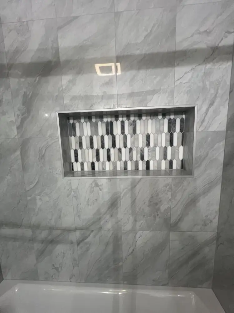 Shower niche with black, white and gray picket mosaic tile, Ohio