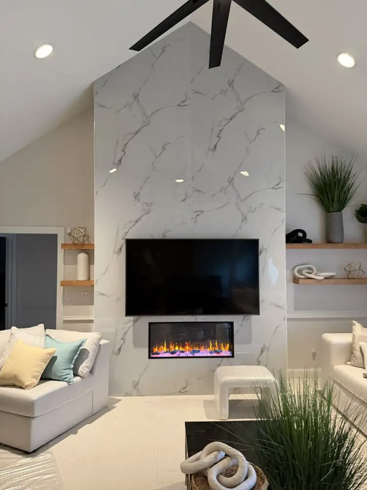 Floor-to-ceiling marble-look porcelain fireplace wall with TV and electric fireplace, Macedonia