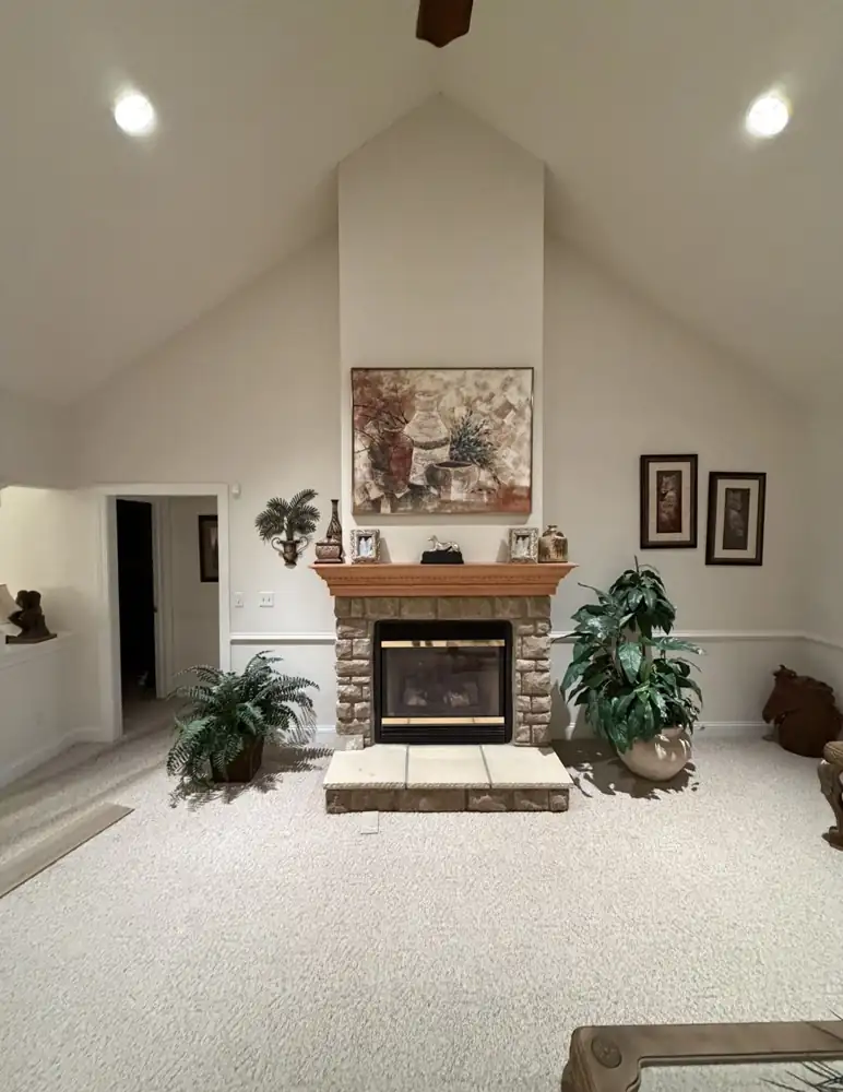 Living room fireplace before remodel with stacked stone surround, Macedonia, Ohio