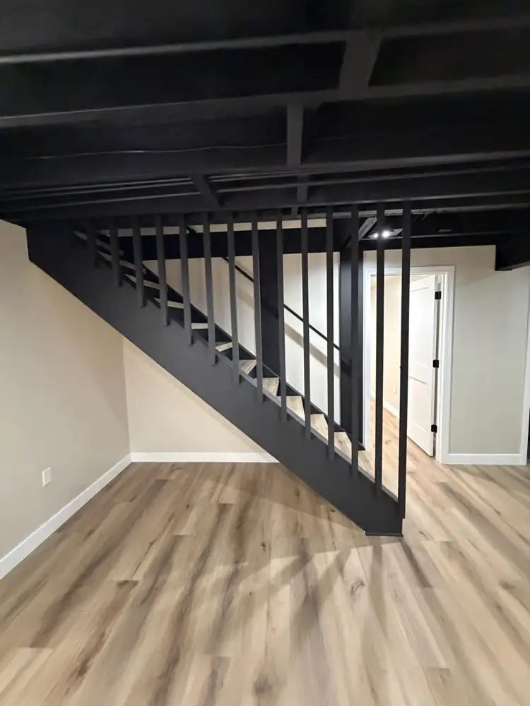 Rebuilt basement staircase painted black with slatted wall, Mantua