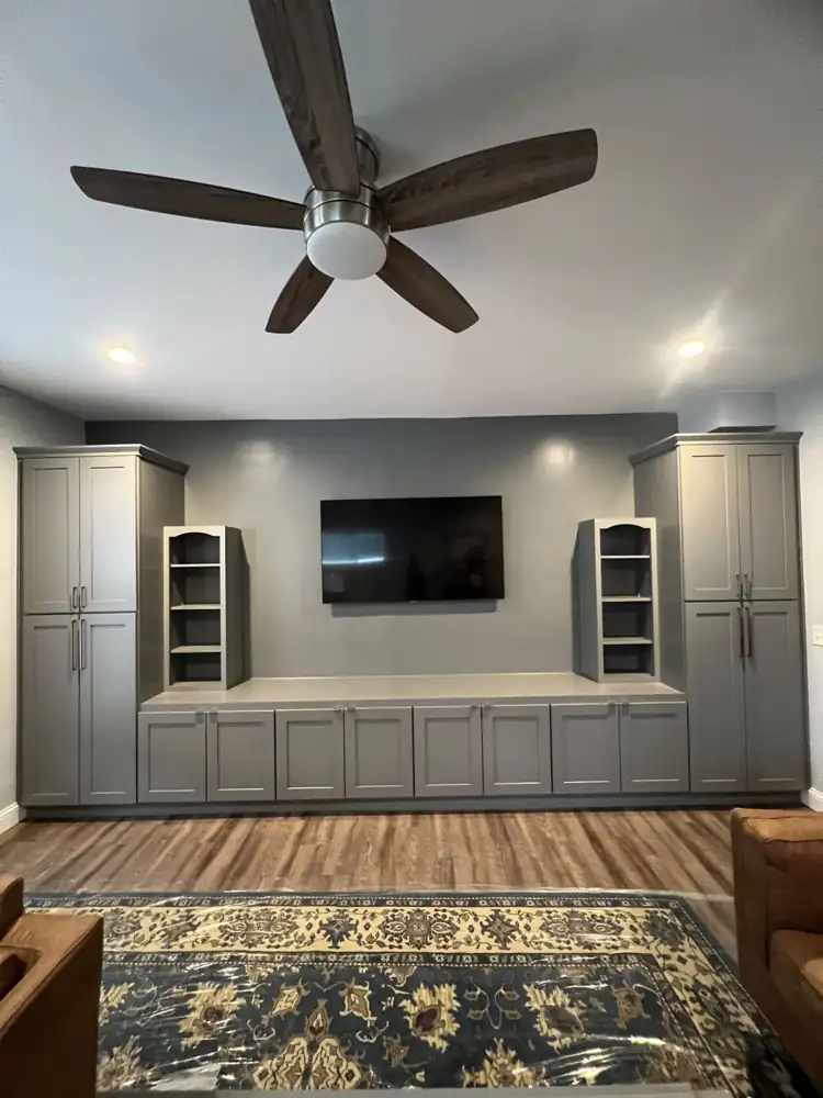 Wall-to-wall gray shaker built-in cabinets with long base cabinets and arched open shelving, Northeast Ohio