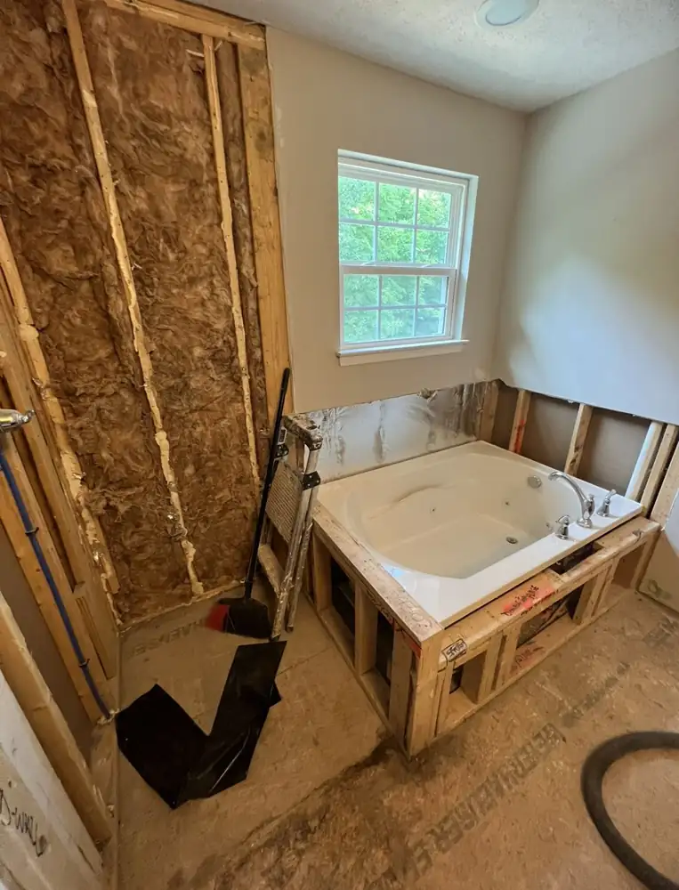Primary bathroom stripped to framing with old jetted tub before remodel, Northeast Ohio