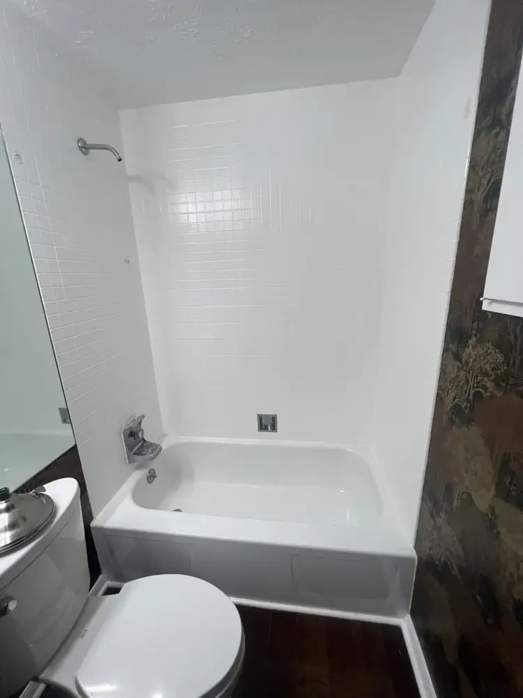 Bathroom with old white square tile tub surround before remodel, Northeast Ohio