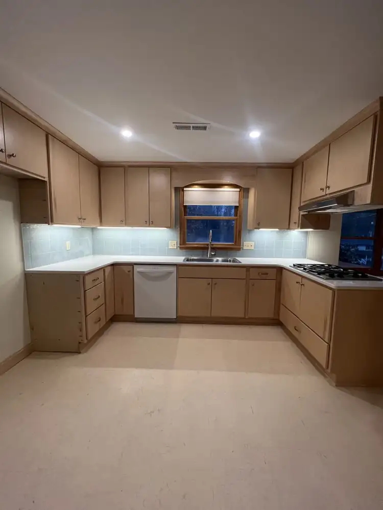 U-shaped maple kitchen with white quartz countertops and recessed lighting, Northeast Ohio