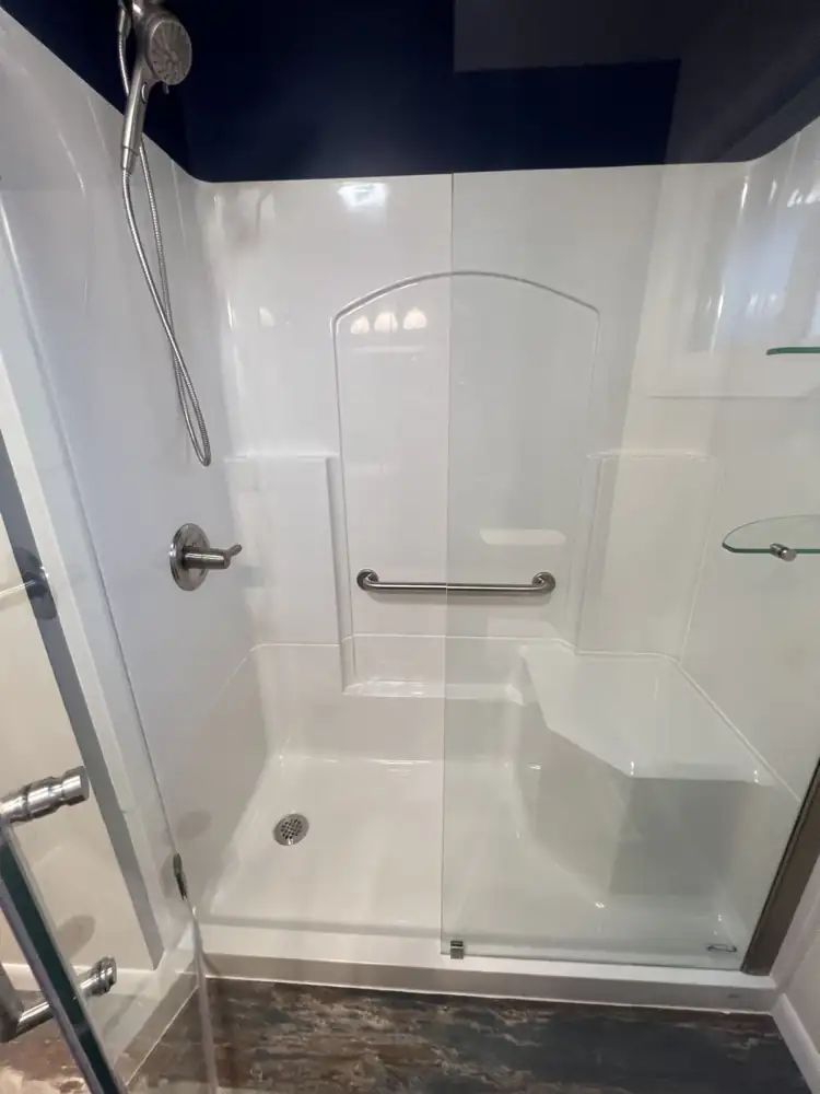 Accessible shower unit with molded bench and stainless grab bar, Northeast Ohio