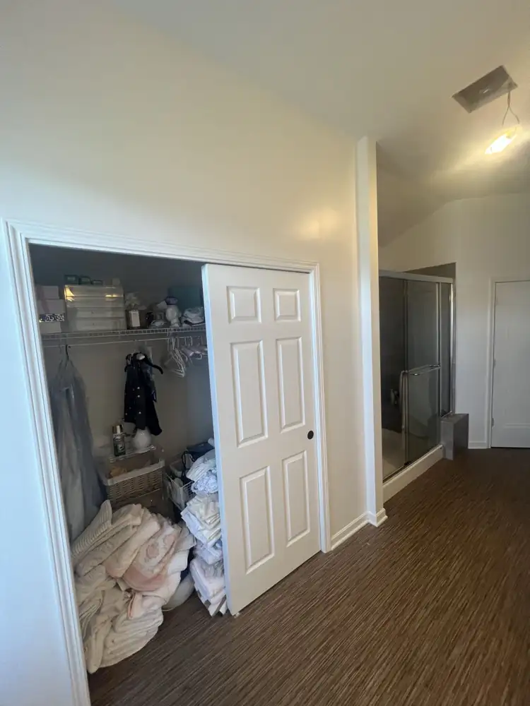Primary bedroom closet and old framed shower before spa bathroom remodel, Northeast Ohio