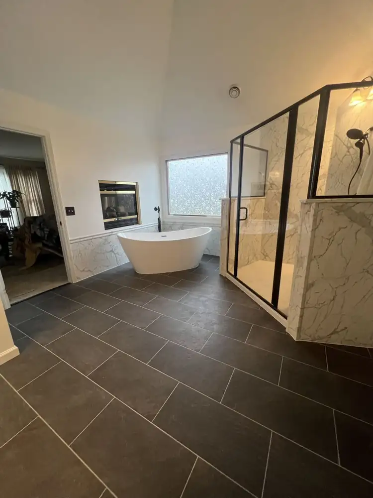 Large primary bathroom with charcoal plank-pattern tile, freestanding tub and walk-in shower, Northeast Ohio
