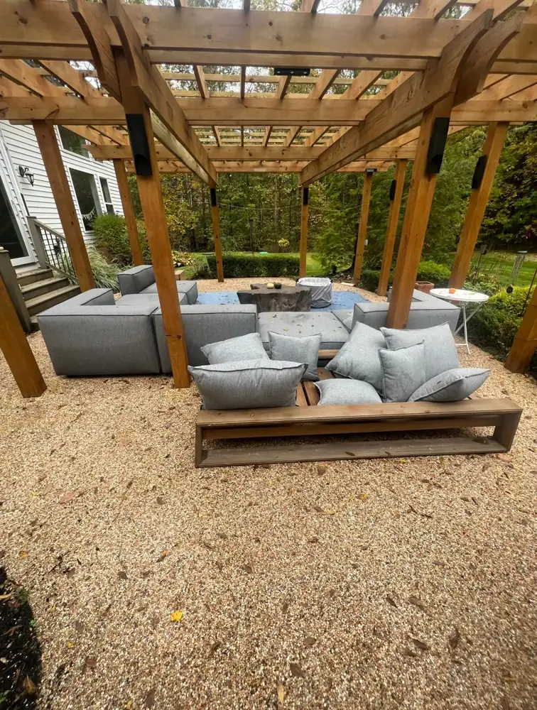 Backyard pergola over loose pea gravel before the new stone patio, Northeast Ohio