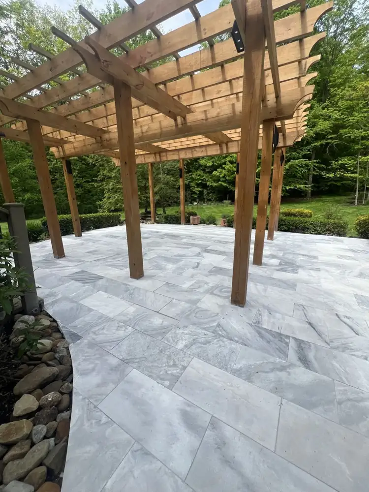 Veined gray marble pavers in a running pattern around the pergola posts, Northeast Ohio