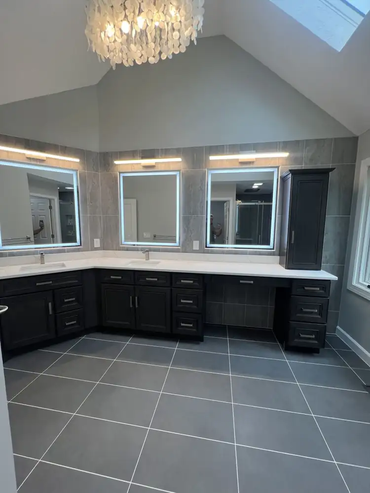 L-shaped double vanity with three LED mirrors, shell chandelier and vaulted ceiling, Northeast Ohio