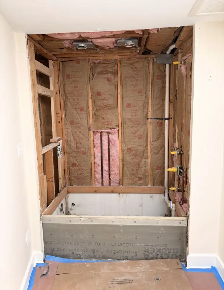Tub alcove stripped to studs and insulation during remodel, Rocky River, Ohio