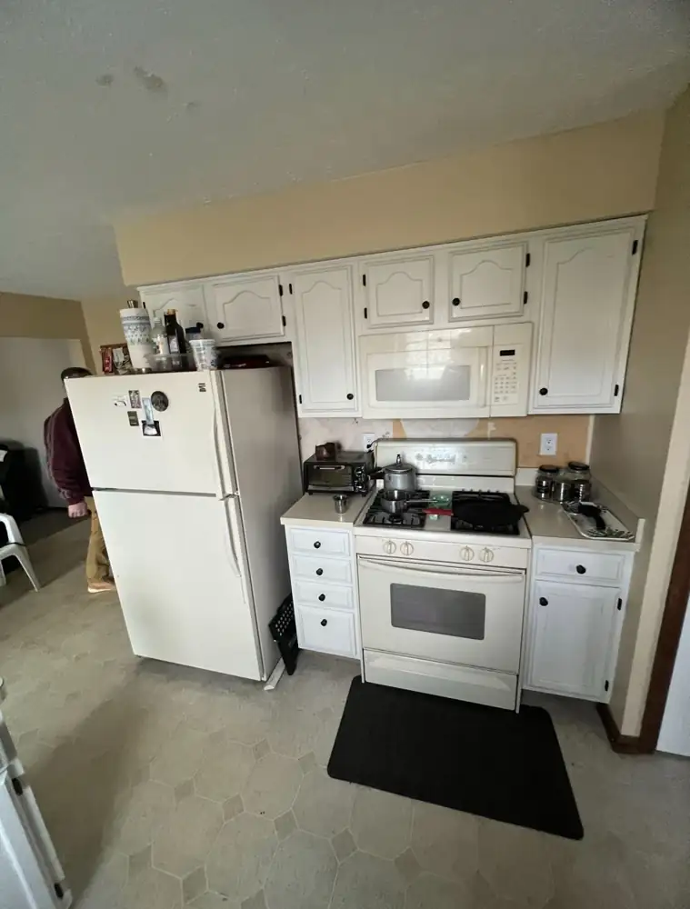 Small dated kitchen with almond appliances and laminate counters before remodel, Rocky River, Ohio