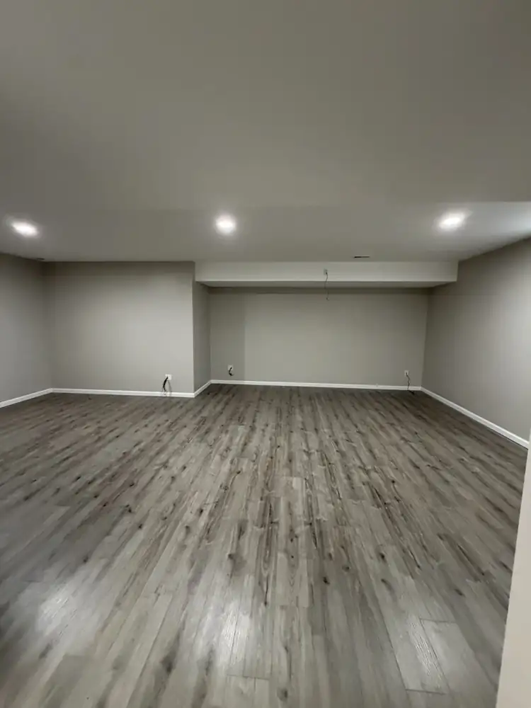 Finished basement with drywall, recessed lighting, soffits and gray plank flooring, Solon, Ohio