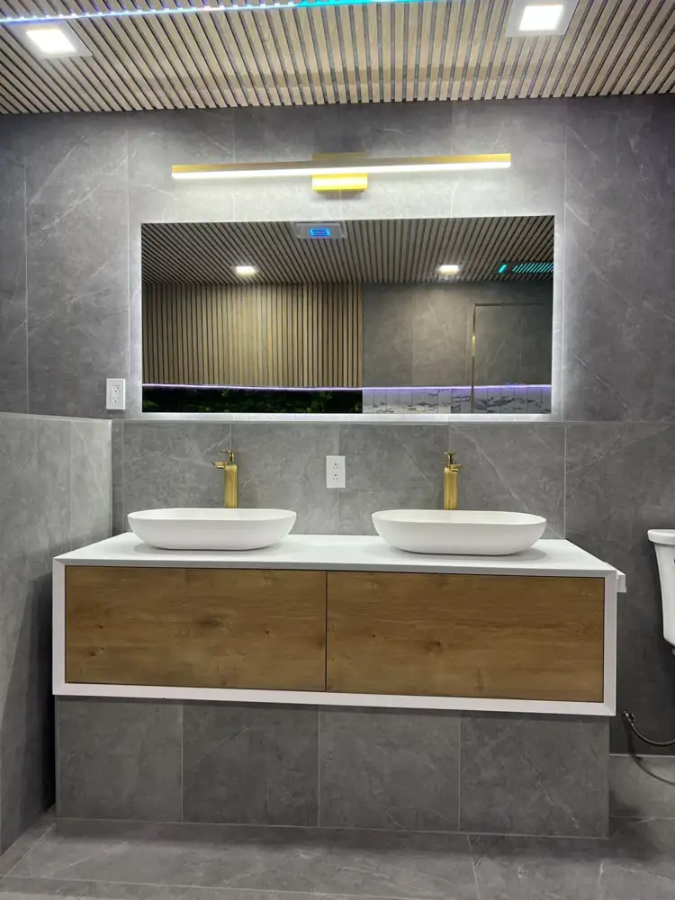 Floating double vanity with vessel sinks, brass faucets and backlit mirror, Ohio