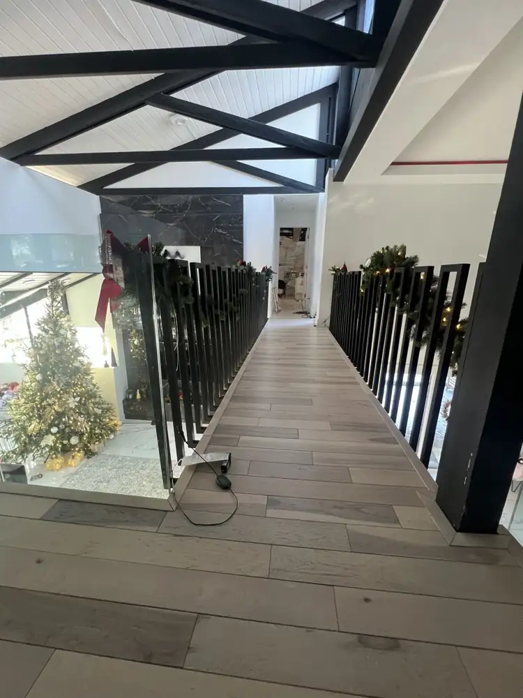 Hardwood flooring installed on an open catwalk