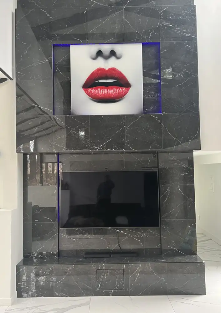 Another view: Bookmatched marble-look porcelain fireplace wall with linear fireplace and TV