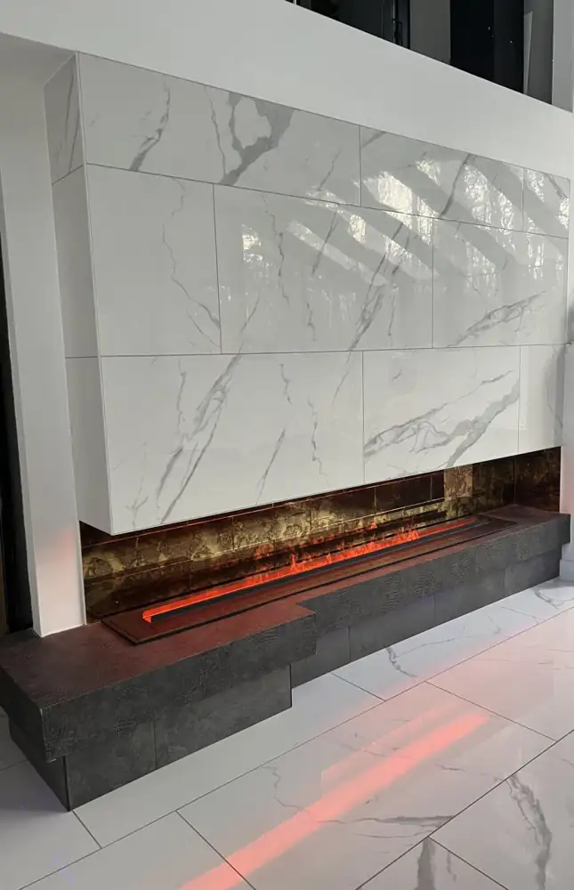 Another view: Bookmatched marble-look porcelain fireplace wall with linear fireplace and TV