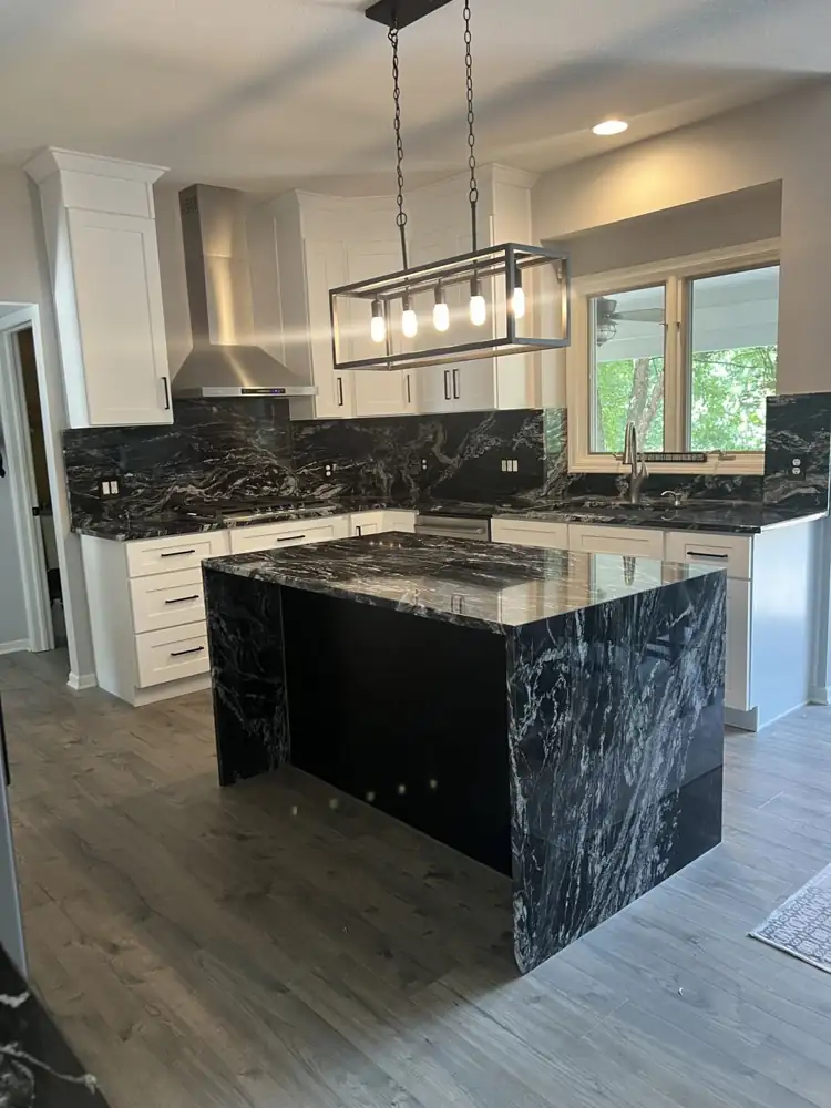 White shaker kitchen with black granite waterfall island, Twinsburg