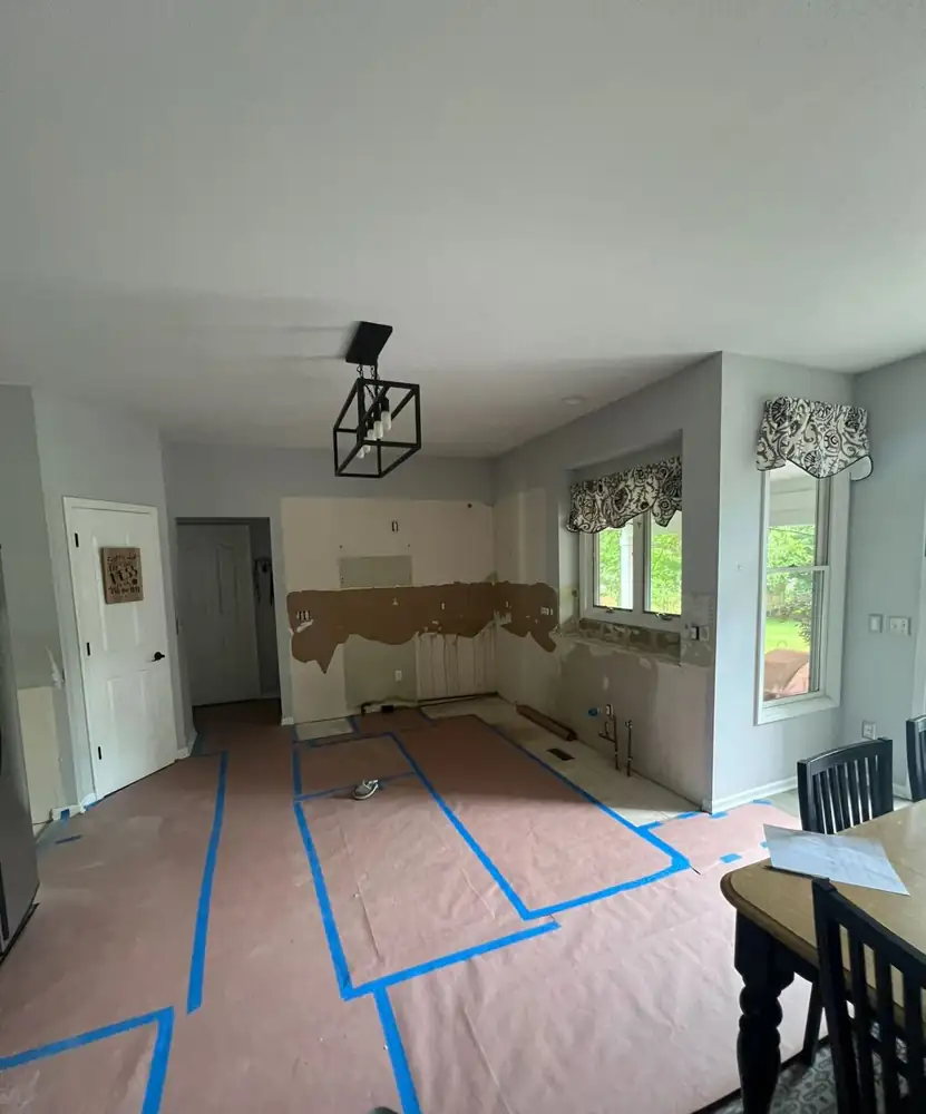 Kitchen after demolition with cabinets removed and layout taped on floor, Twinsburg, Ohio